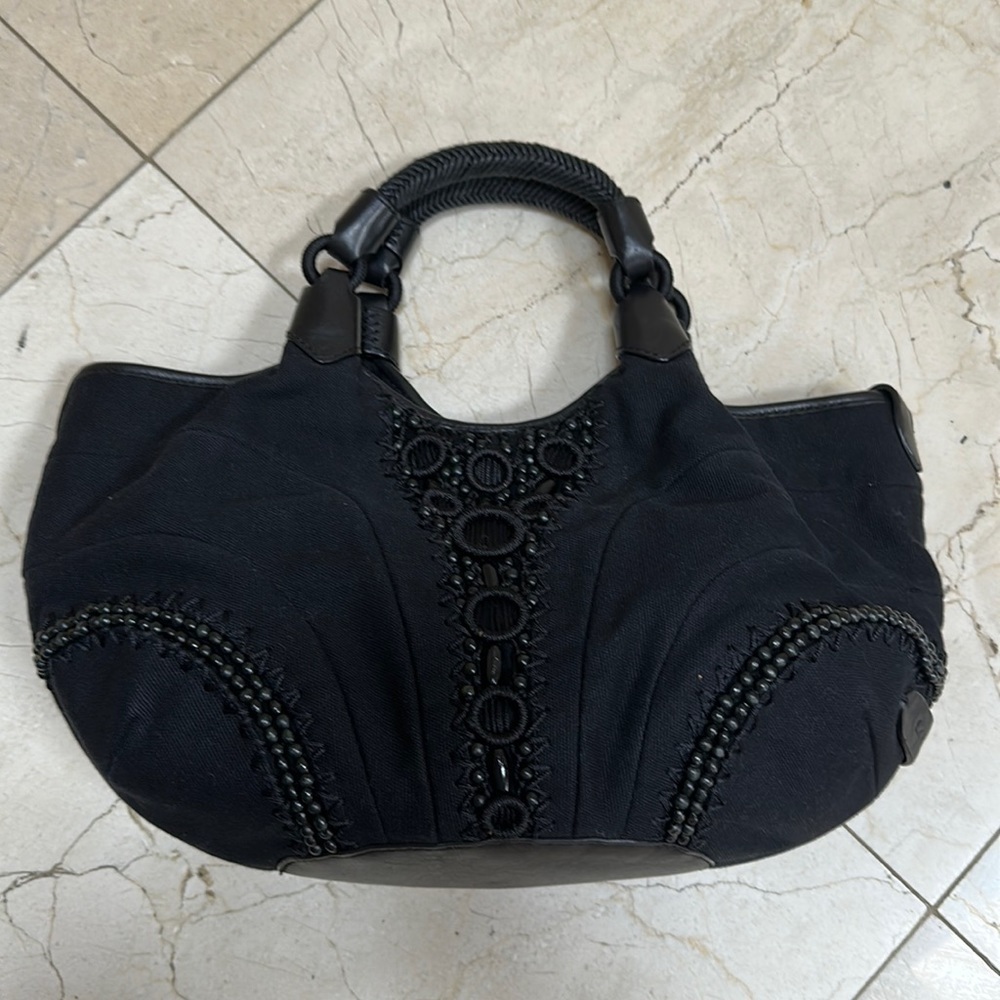 ColeHaaan black handbag.​​​​​​​​​​​​​​​​​